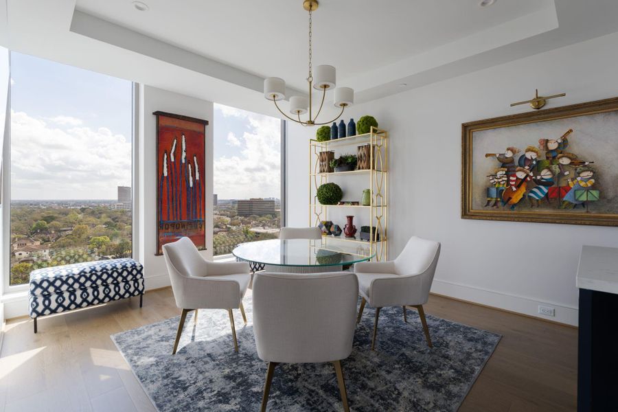 A breakfast room should breathe, and when you’re 14 levels up, it does exactly that. By keeping the decor light and the footprint open, the focus stays exactly where it should be—on the shifting colors of the morning sky. Whether it’s a gold-drenched sunrise or a moody, overcast morning, this space serves as a front-row seat to the horizon. It’s high-rise living that feels less like a glass box and more like a breath of fresh air. A breakfast room should breathe, and when you’re 14 levels up, it does exactly that. By keeping the decor light and the footprint open, the focus stays exactly where it should be—on the shifting colors of the morning sky. Whether it’s a gold-drenched sunrise or a moody, overcast morning, this space serves as a front-row seat to the horizon. It’s high-rise living that feels less like a glass box and more like a breath of fresh air.