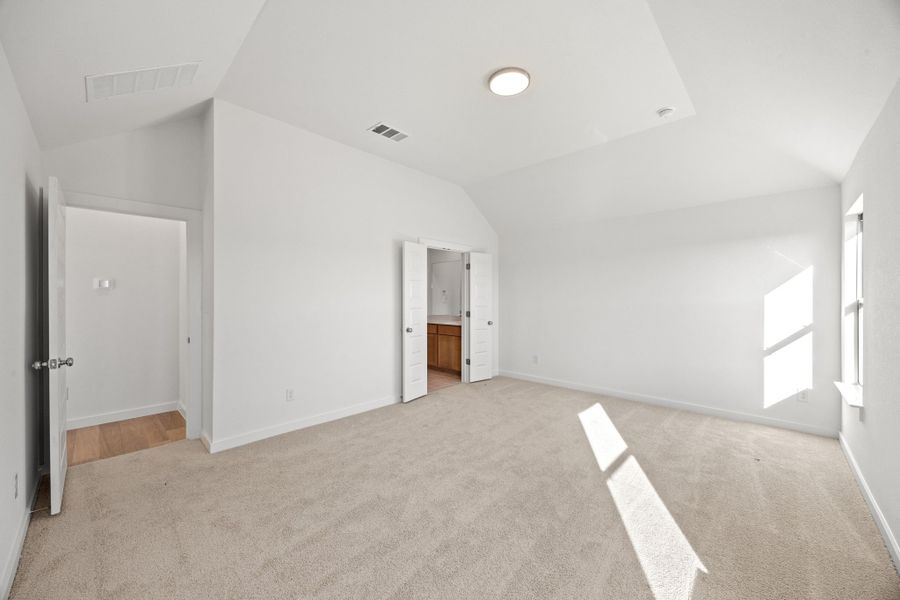 Primary Bedroom in the Turquoise home plan by Trophy Signature Homes – REPRESENTATIVE PHOTO