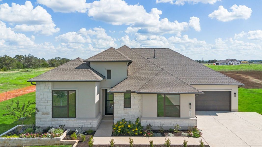 Front exterior of a new home in Leander Estates, Leander, TX, highlighting curb appeal (Image 21).