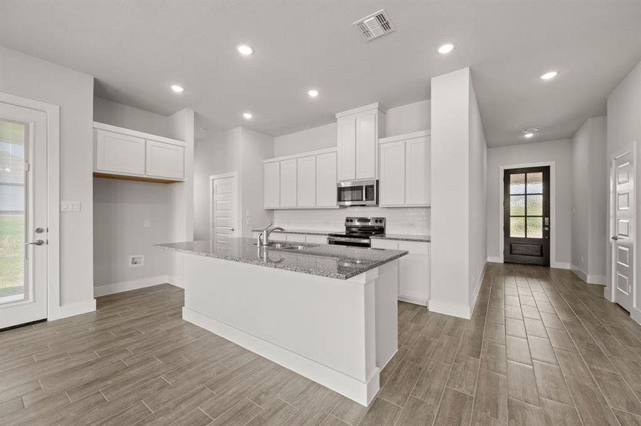 Furnished interior view inside a new home in Saddleback Estates, Boyd (Image 8).