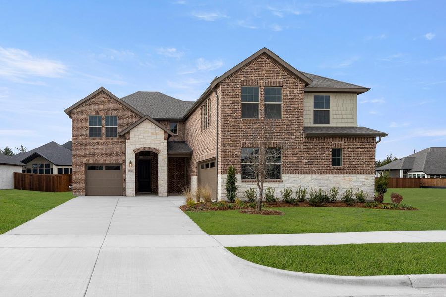 Front exterior of a new home in Somerset Park, Rockwall, TX, highlighting curb appeal (Image 2). Front exterior of a new home in Somerset Park, Rockwall, TX, highlighting curb appeal (Image 2).