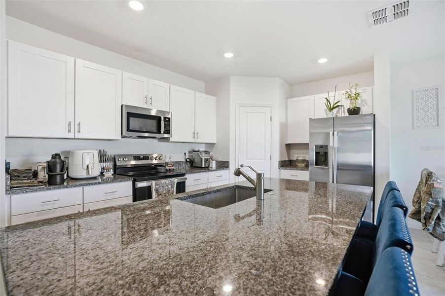 Furnished interior view inside a new home in The Isle of Avalon, Spring Hill (Image 12).