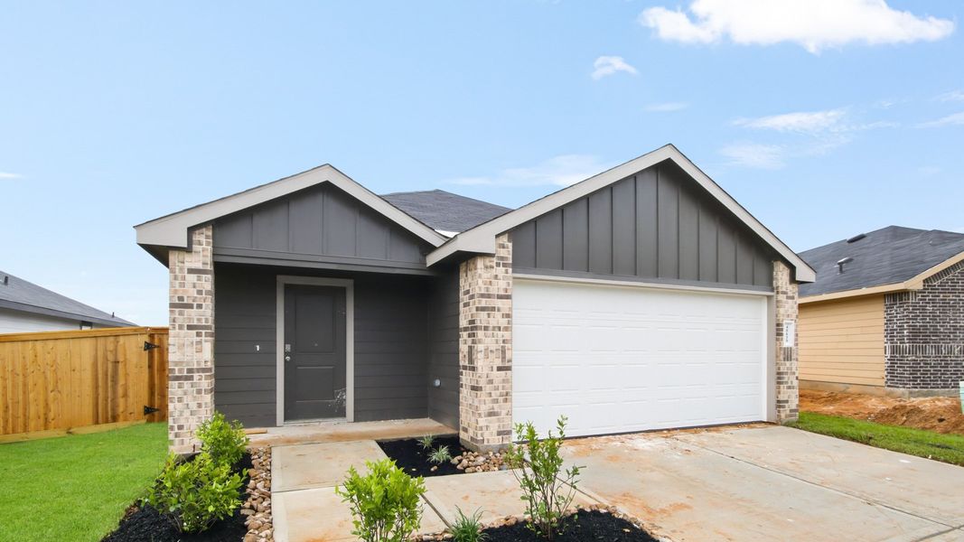 Front exterior of a new home in Mill Creek, Magnolia, TX, highlighting curb appeal (Image 2). Front exterior of a new home in Mill Creek, Magnolia, TX, highlighting curb appeal (Image 2).