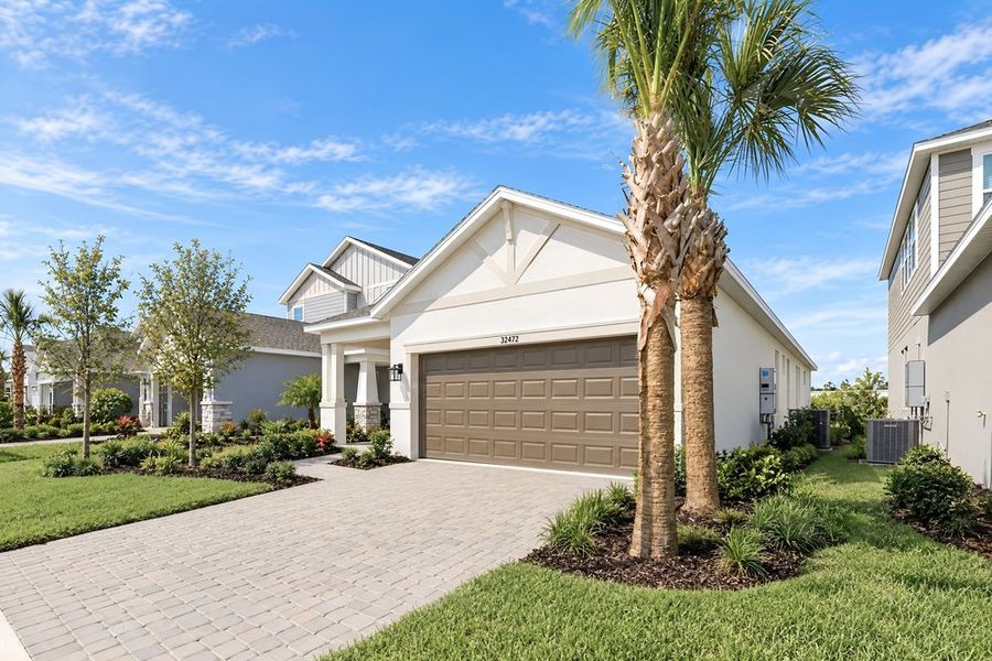 Front exterior of a new home in Lochside, Mount Dora, FL, highlighting curb appeal (Image 24). Front exterior of a new home in Lochside, Mount Dora, FL, highlighting curb appeal (Image 24).