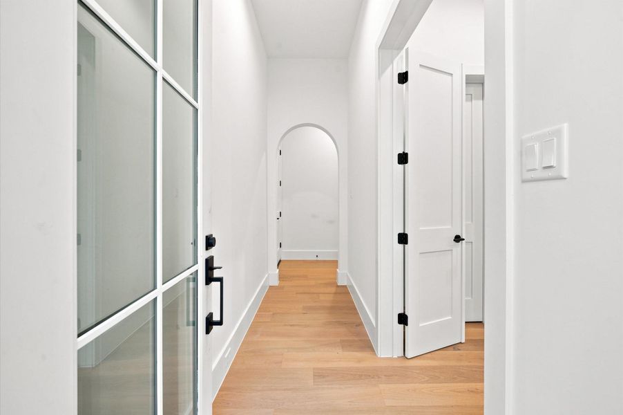 Step inside this thoughtfully designed home featuring elegant arched doorways throughout.