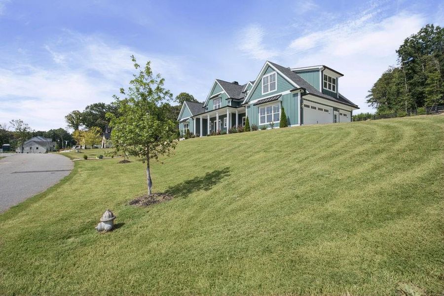 Front exterior of a new home in , Dacula, GA, highlighting curb appeal (Image 27). Front exterior of a new home in , Dacula, GA, highlighting curb appeal (Image 27).