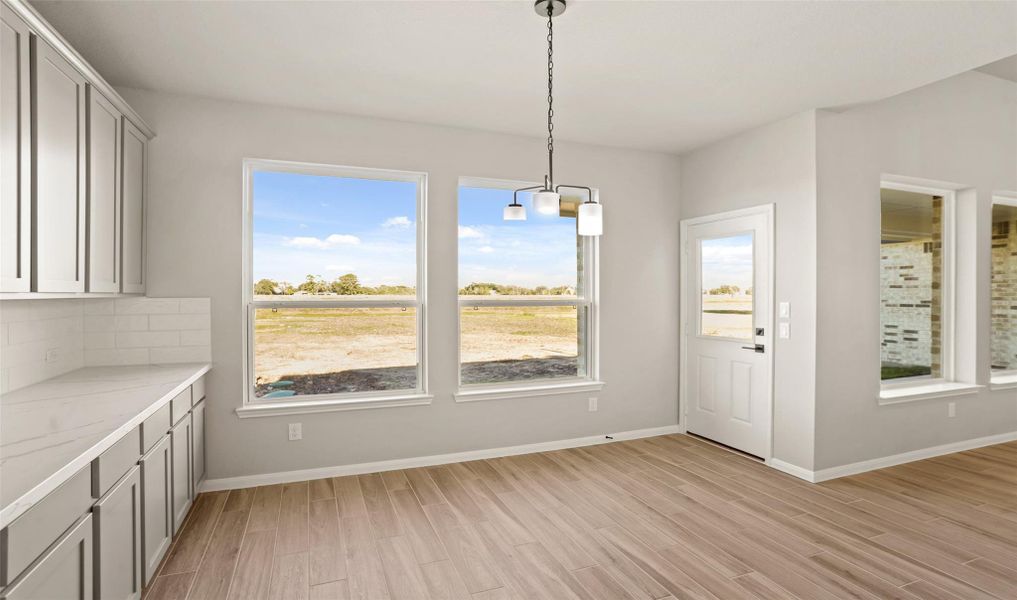Sun-lit dining area (*Photo not of actual home and used for illustration purposes only.)