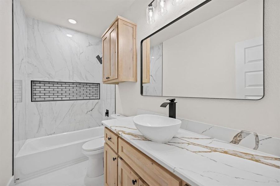 Full bathroom with vanity, bathtub / shower combination, and recessed lighting