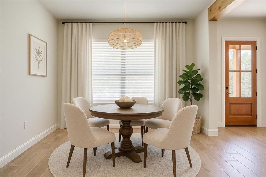 Dining area featuring light wood-style floors and baseboards Dining area featuring light wood-style floors and baseboards