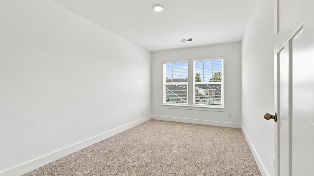 First-class bedroom with generous proportions, a walk-in closet, and beautiful natural light through large windows First-class bedroom with generous proportions, a walk-in closet, and beautiful natural light through large windows