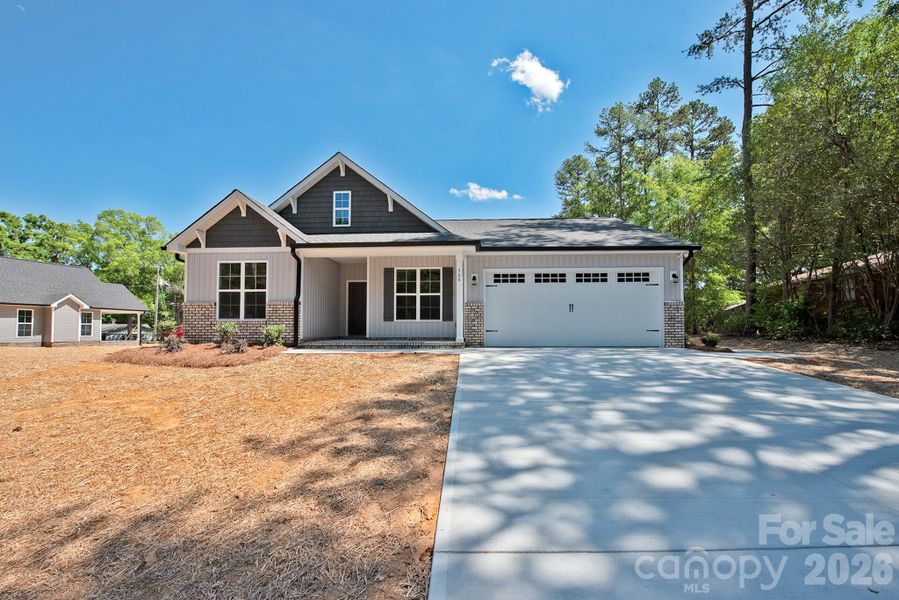 Front exterior of a new home in , Concord, NC, highlighting curb appeal (Image 17).