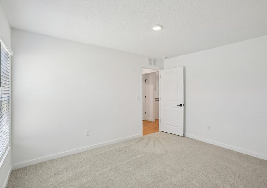 Each secondary bedroom includes carpet, a closet and a bright open window Each secondary bedroom includes carpet, a closet and a bright open window