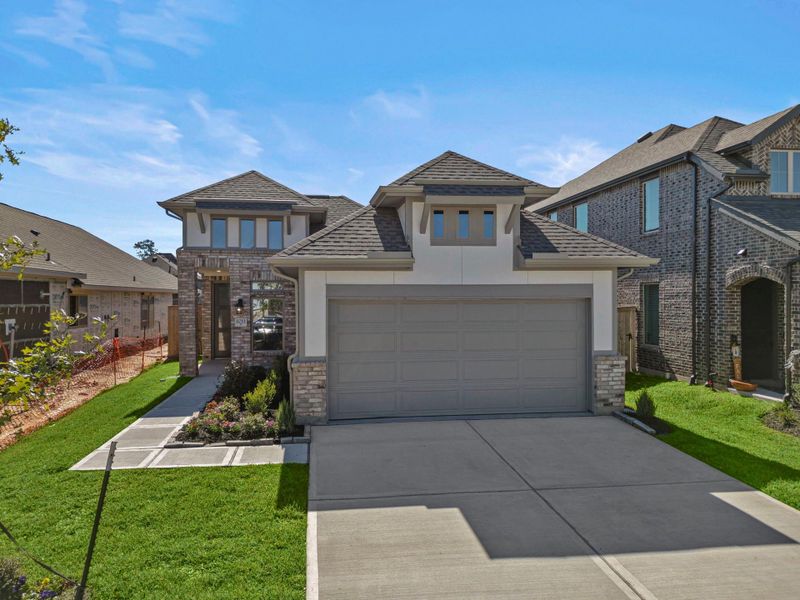Front exterior of a new home in Grand Central Park, Conroe, TX, highlighting curb appeal (Image 21). Front exterior of a new home in Grand Central Park, Conroe, TX, highlighting curb appeal (Image 21).