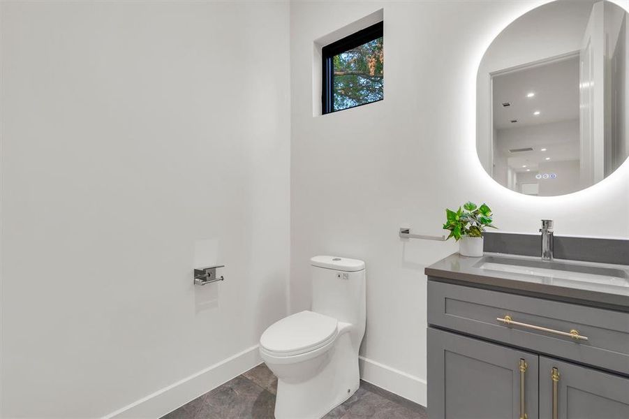 Bathroom featuring vanity and recessed lighting