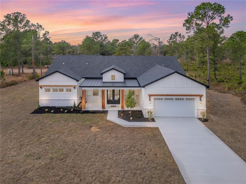 Front exterior of a new home in , Eustis, FL, highlighting curb appeal (Image 26). Front exterior of a new home in , Eustis, FL, highlighting curb appeal (Image 26).
