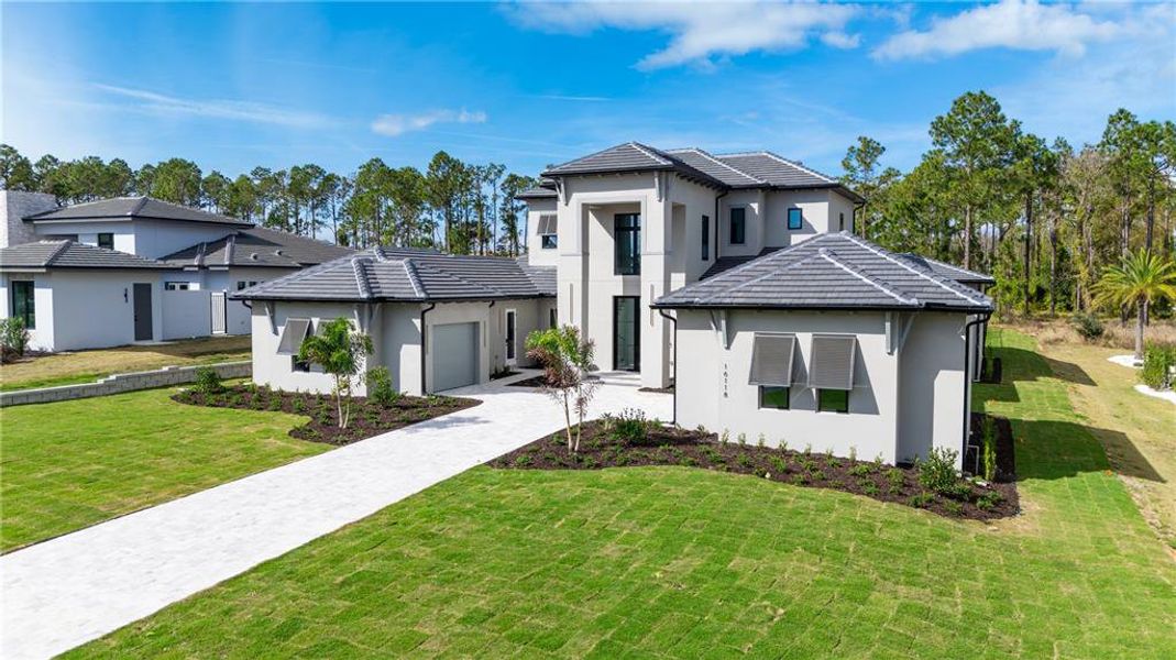 Front exterior of a new home in , Montverde, FL, highlighting curb appeal (Image 27). Front exterior of a new home in , Montverde, FL, highlighting curb appeal (Image 27).