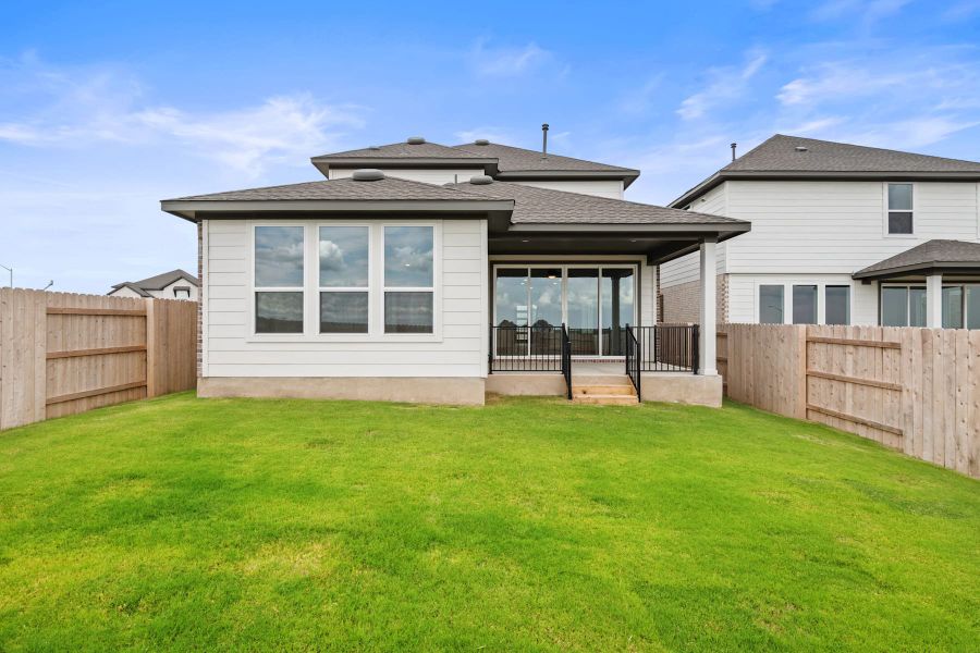 Exterior details and patio area of a home in Lariat, Liberty Hill (Image 27).