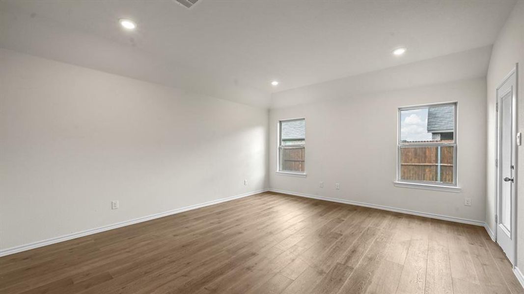 Unfurnished room featuring dark wood-style floors and recessed lighting