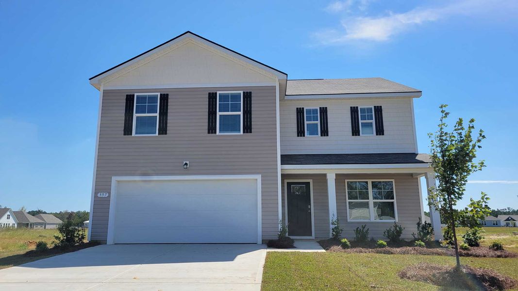 Front exterior of a new home in Heritage Crossing, Conway, SC, highlighting curb appeal (Image 1).