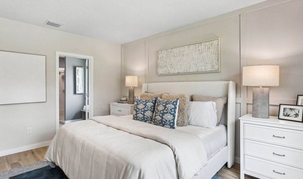 Primary suite with decorative feature wall