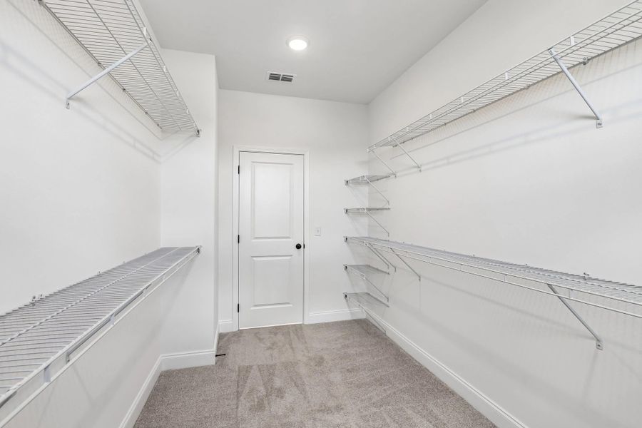 Primary Walk-in Closet Primary Walk-in Closet