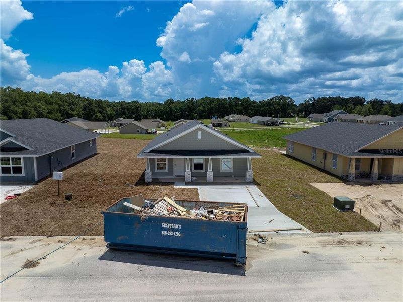 Front exterior of a new home in Rolling Hills, Bell, FL, highlighting curb appeal (Image 1).