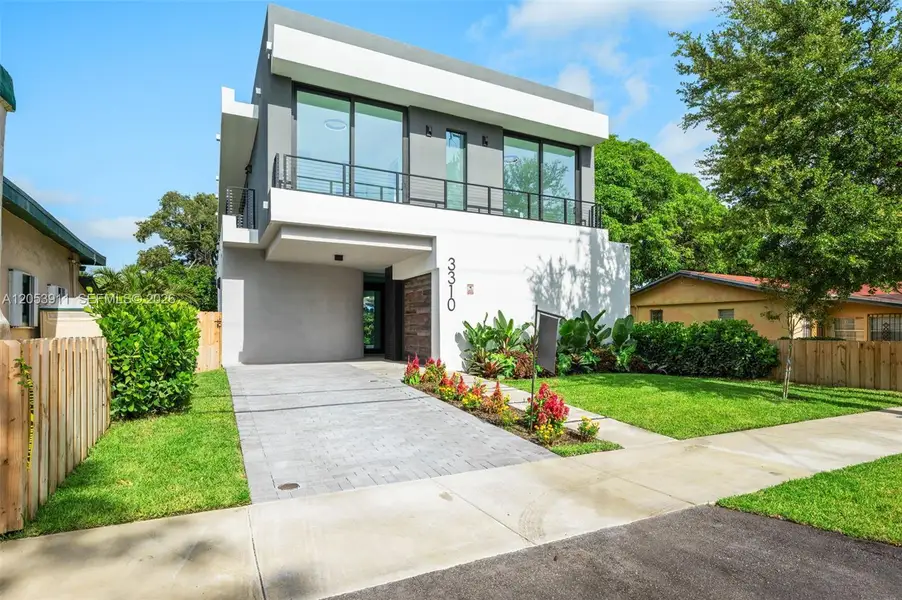 Front exterior of a new home in , Miami, FL, highlighting curb appeal (Image 1). Front exterior of a new home in , Miami, FL, highlighting curb appeal (Image 1).
