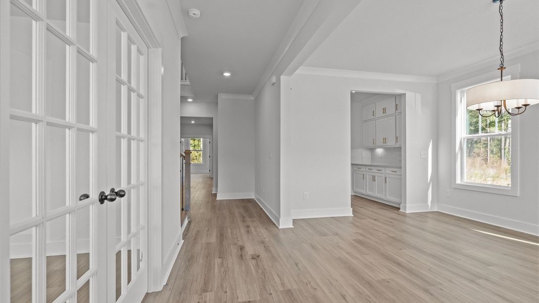 Superior design begins at the front door with a hardwood floor foyer and elegant sightlines