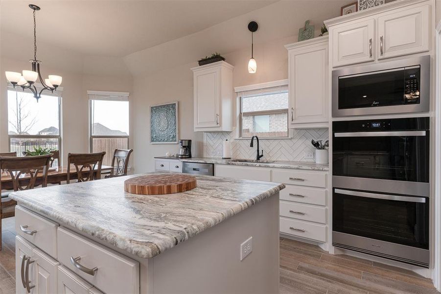 Kitchen with double oven and upgraded lighting