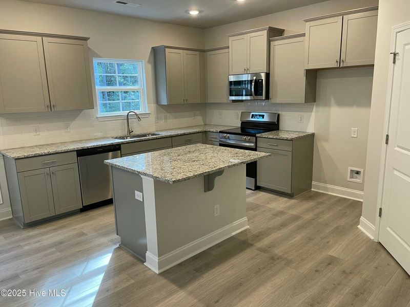Furnished interior view inside a new home in Mill Creek Cove, Bolivia (Image 6).