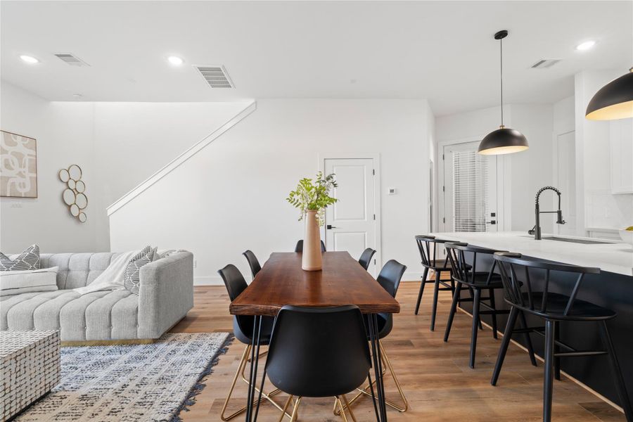 High ceilings, bright natural light, and a thoughtfully designed open floor plan create a welcoming and functional living area.