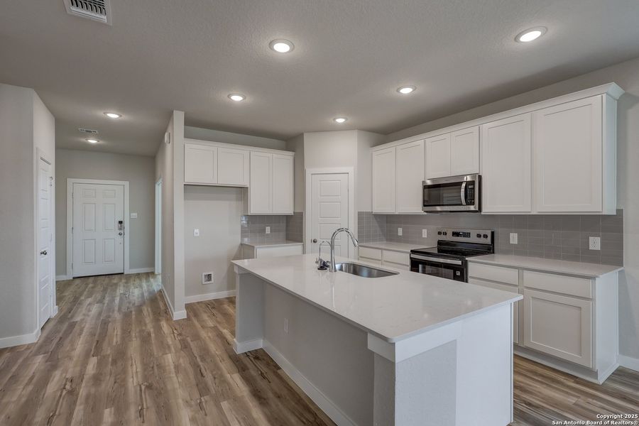 Furnished interior view inside a new home in Cinco Lakes, San Antonio (Image 9).