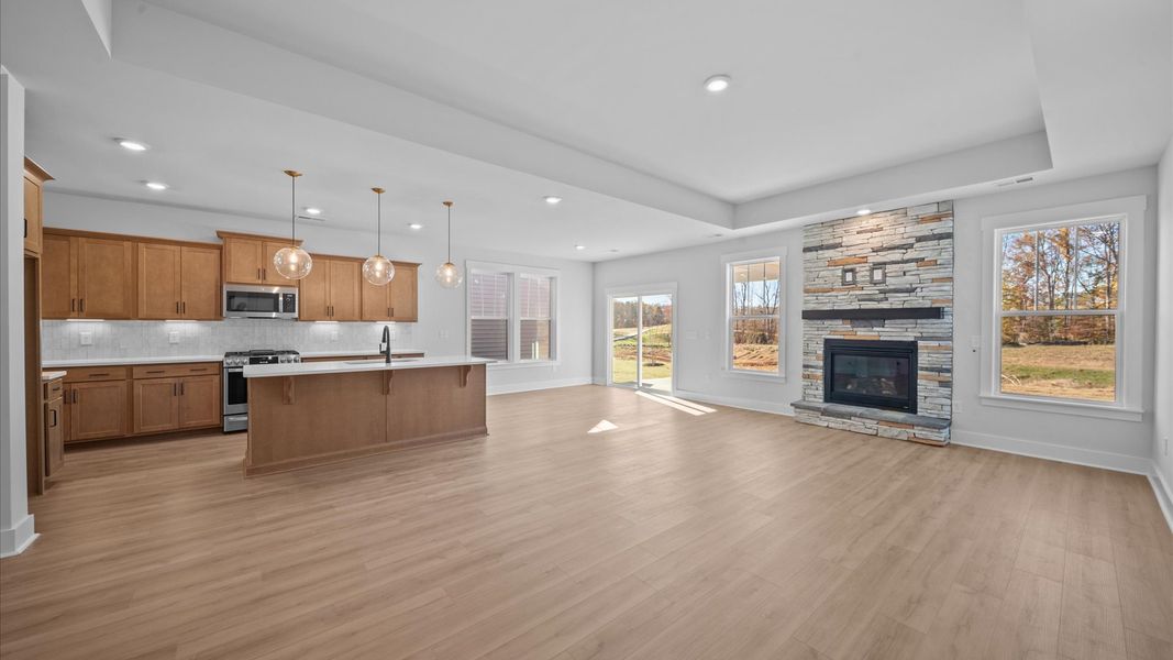 Vibrant and welcoming family room anchored by clean lines, tasteful materials, and abundant light