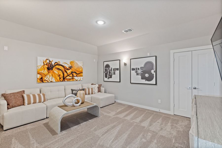 Media room in the Mercury II home plan by Trophy Signature Homes – REPRESENTATIVE PHOTO