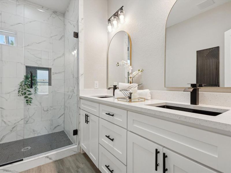 Bathroom with vanity, wood-type flooring, and walk in shower