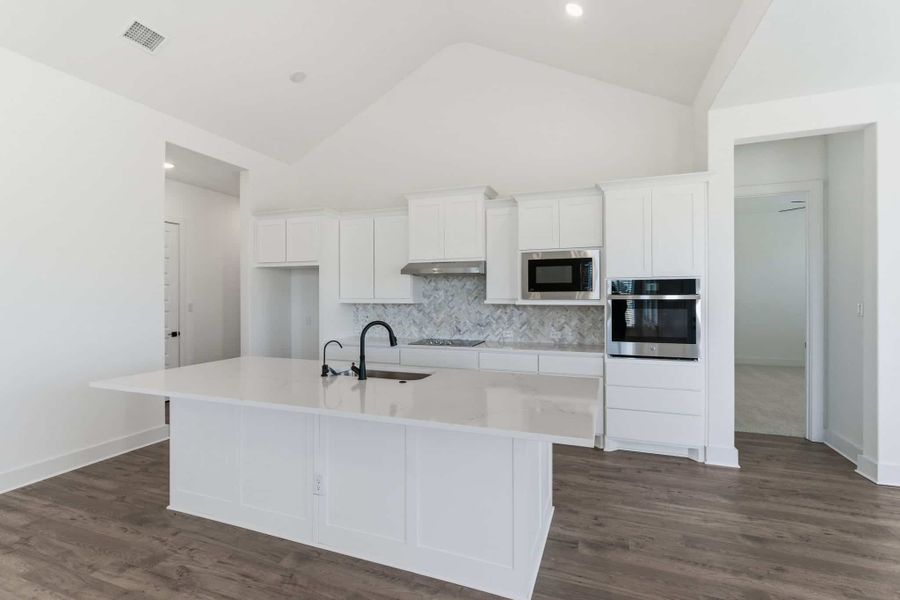 Representative furnished interior of a home built from the Malibu by Chesmar Homes in Sienna Lakes, San Antonio (Image 5).