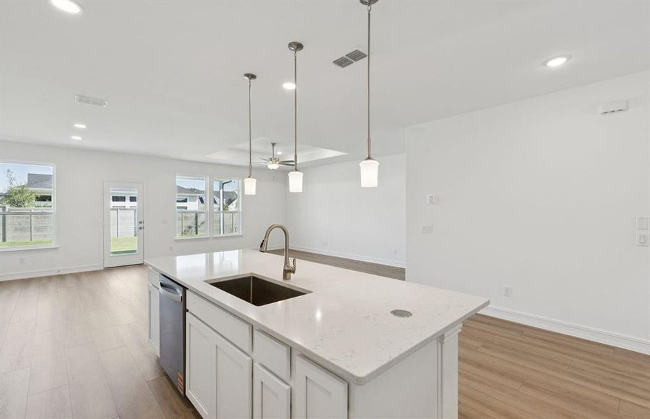 Bright kitchen with an expansive center island perfect for gatherings