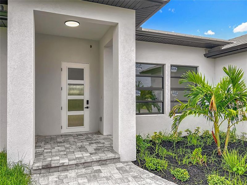 Front exterior of a new home in , Placida, FL, highlighting curb appeal (Image 29). Front exterior of a new home in , Placida, FL, highlighting curb appeal (Image 29).
