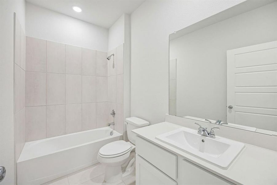 Bathroom in the Stanley II home plan by Trophy Signature Homes – REPRESENTATIVE PHOTO