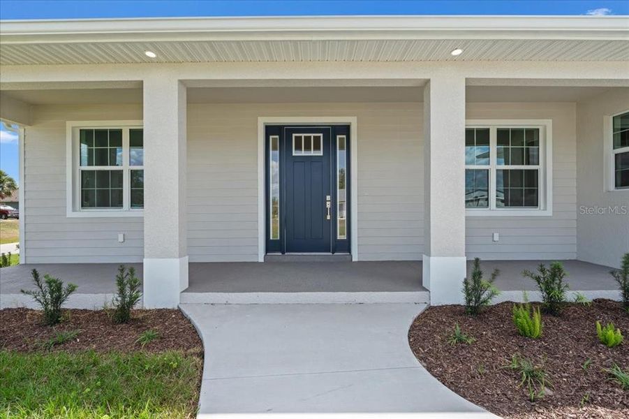 Front exterior of a new home in , Englewood, FL, highlighting curb appeal (Image 1). Front exterior of a new home in , Englewood, FL, highlighting curb appeal (Image 1).