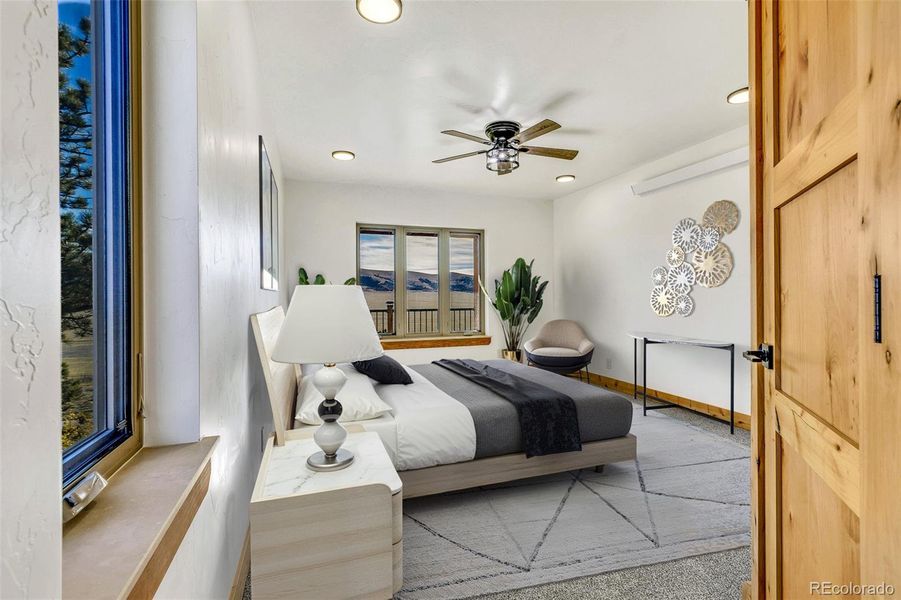 Virtually staged main level primary bedroom