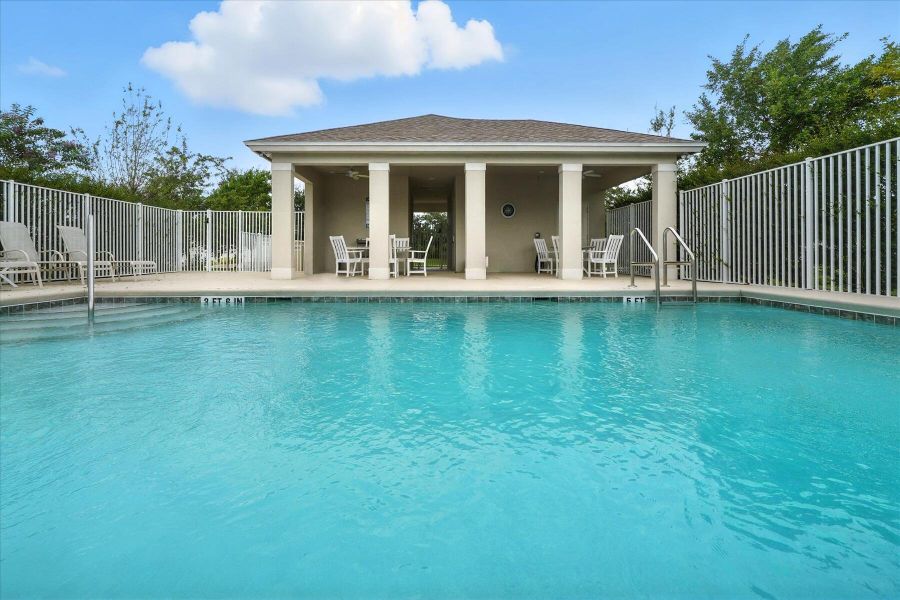 Front exterior of a new home in Bella Rosa, Vero Beach, FL, highlighting curb appeal (Image 21). Front exterior of a new home in Bella Rosa, Vero Beach, FL, highlighting curb appeal (Image 21).