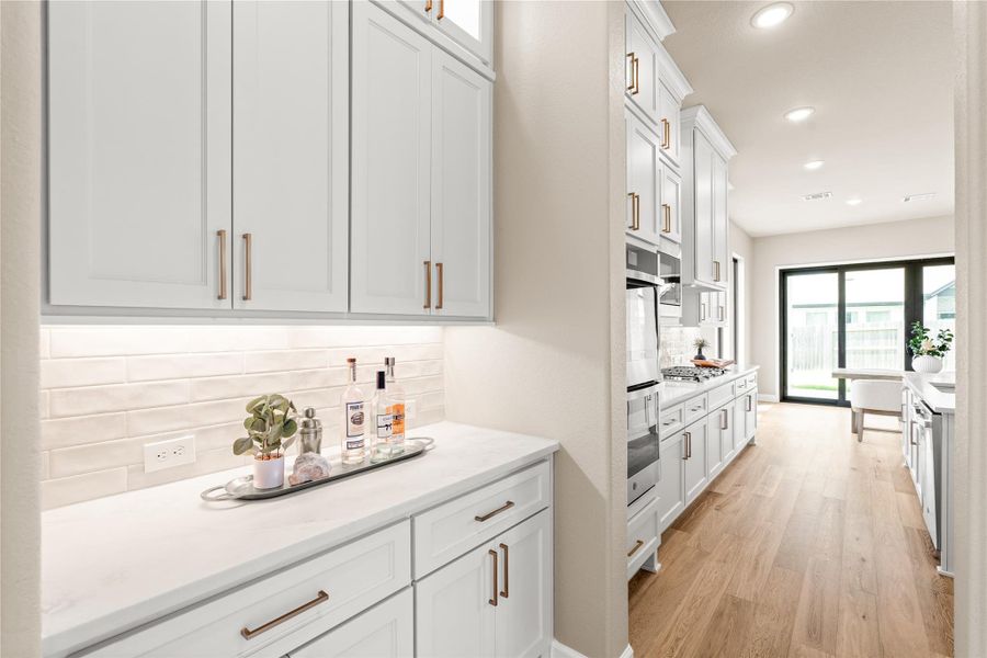 Butlers' area offers extended storage and serving space between your kitchen and formal dining room. *Virtually Staged*