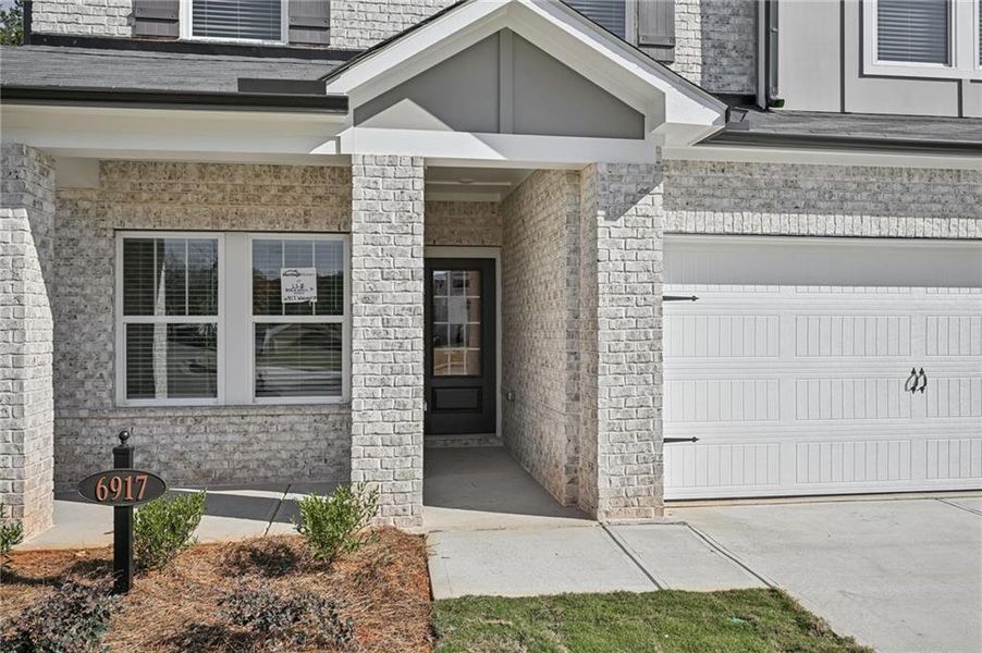 Exterior details and patio area of a home in Creekside at Oxford Park, Fairburn (Image 4).
