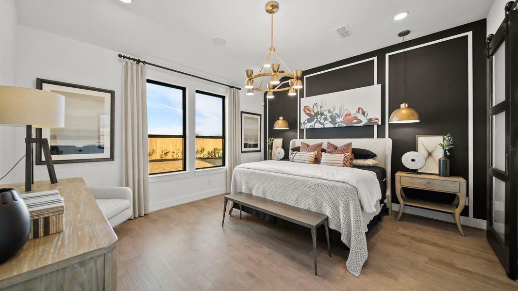 Distinguished main bedroom is enhanced by a dramatic gold chandelier, sizable gold pendants, and an elegantly customized accent wall. With plenty of space for a king size bed, this main bedroom is what dreams are made of (literally). Distinguished main bedroom is enhanced by a dramatic gold chandelier, sizable gold pendants, and an elegantly customized accent wall. With plenty of space for a king size bed, this main bedroom is what dreams are made of (literally).