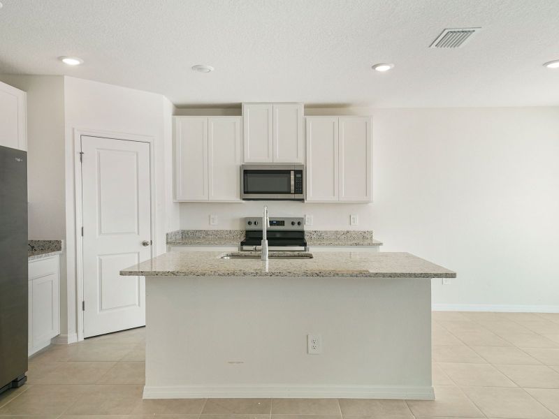 Furnished interior view inside a new home in The Reserve at Van Oaks, Auburndale (Image 3).