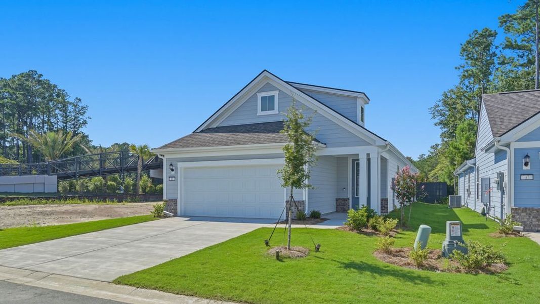 Front exterior of a new home in Sun City Hilton Head, Bluffton, SC, highlighting curb appeal (Image 21).