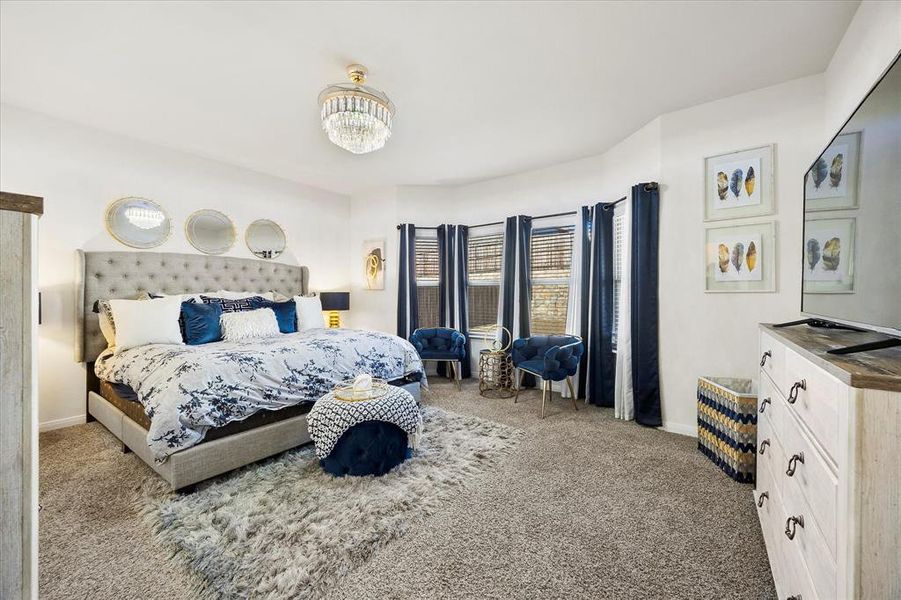 Gorgeous master bedroom includes sitting area