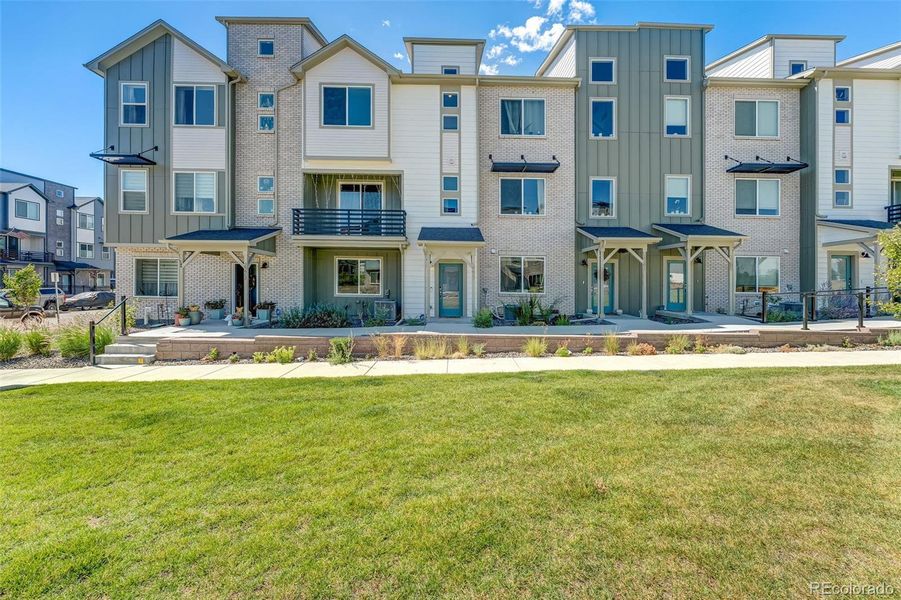 Front exterior of a new home in , Broomfield, CO, highlighting curb appeal (Image 1).