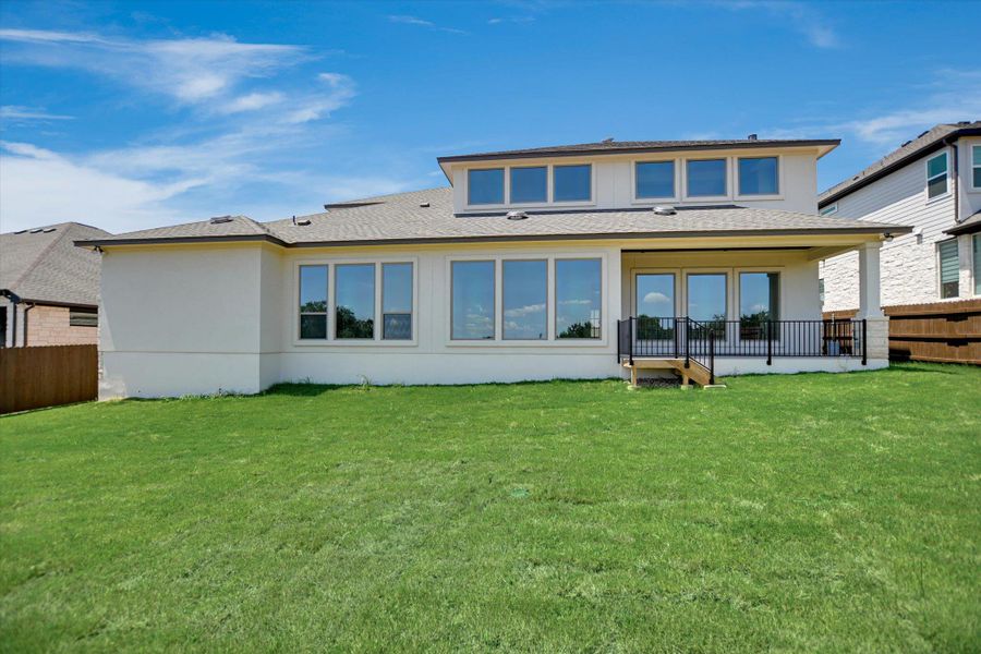 Front exterior of a new home in Riverstone, Georgetown, TX, highlighting curb appeal (Image 19). Front exterior of a new home in Riverstone, Georgetown, TX, highlighting curb appeal (Image 19).